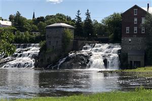 A view of the falls in Falls Park on a sunny day.